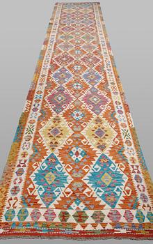 A Kilim runner, classic design, approximately 771 x 127 cm.