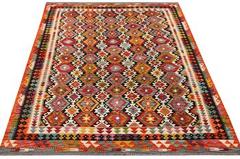 An Afghan Kilim carpet, c. 298 x 202 cm.