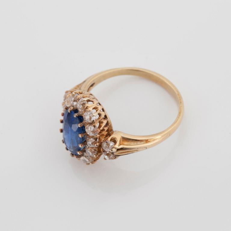 A RING set with a mixed-cut sapphire.