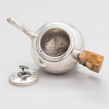 A late 18th-century silver teapot with a Karelian birch handle, Saint Petersburg 1791. Assay master Nikifor Moshchalkin.