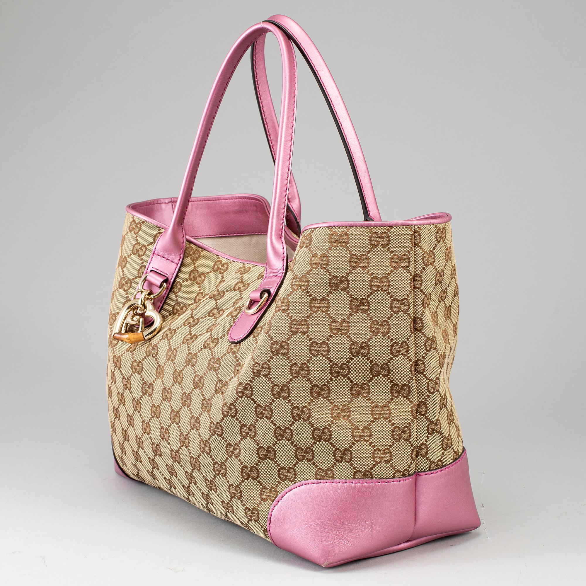 GUCCI, a monogram canvas and pink metallic leather handbag.