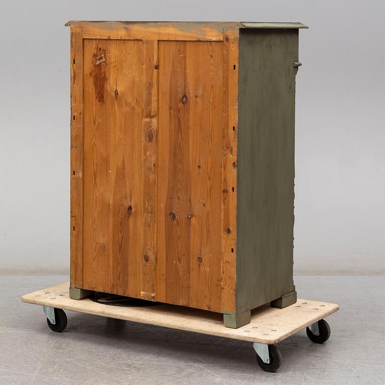 A painted chest of drawers, circa 1900.