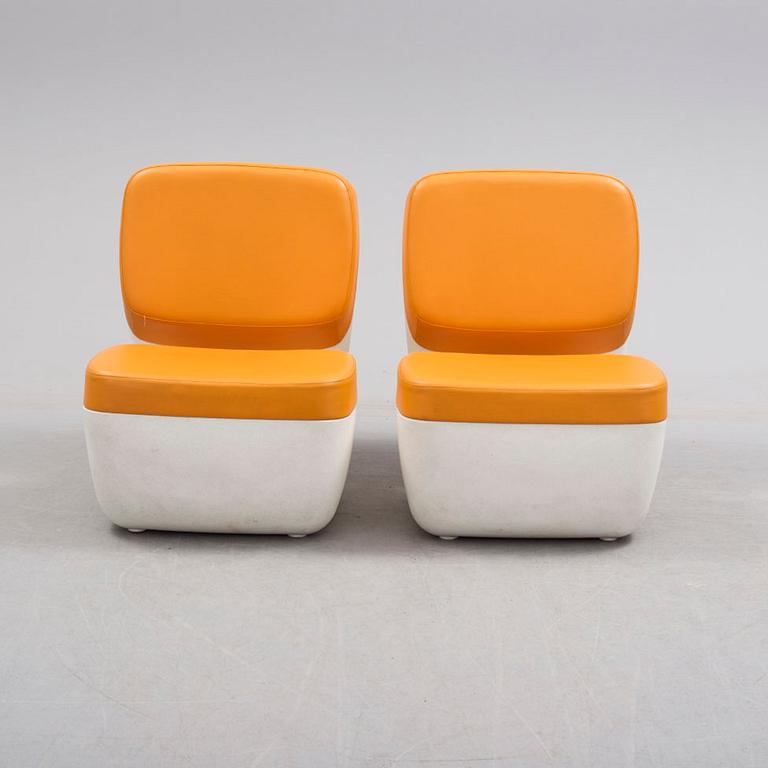 A pair of plastic "Nimrod" easy chairs by Marc Newson, Magis, Italy.