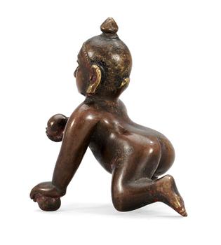 AN ASIAN BRONZE FIGURE,