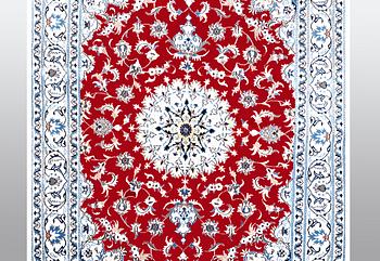 A carpet, Nain, part silk, ca 238 x 170 cm.