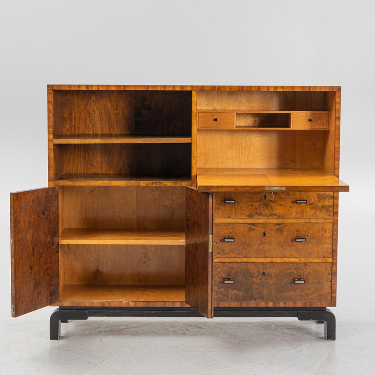 A 1930's birch-veneered bookcase.