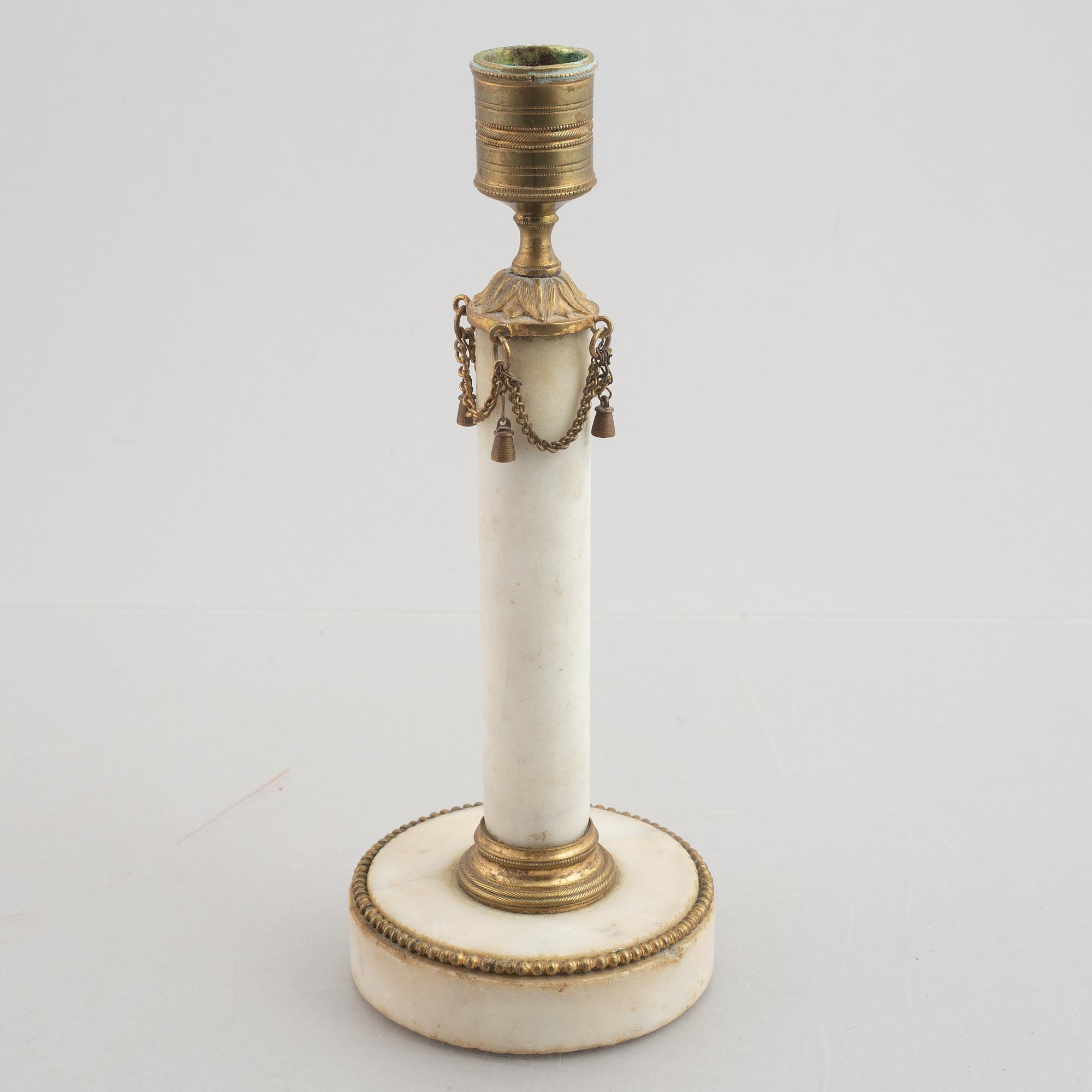 A late Gustavian gilt brass and marble candlestick, late 18th century.