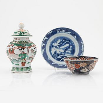 A Chinese dinner plate and a Japanese imari bowl, 18th Century together with a Chinese 19th Century jar with cover.