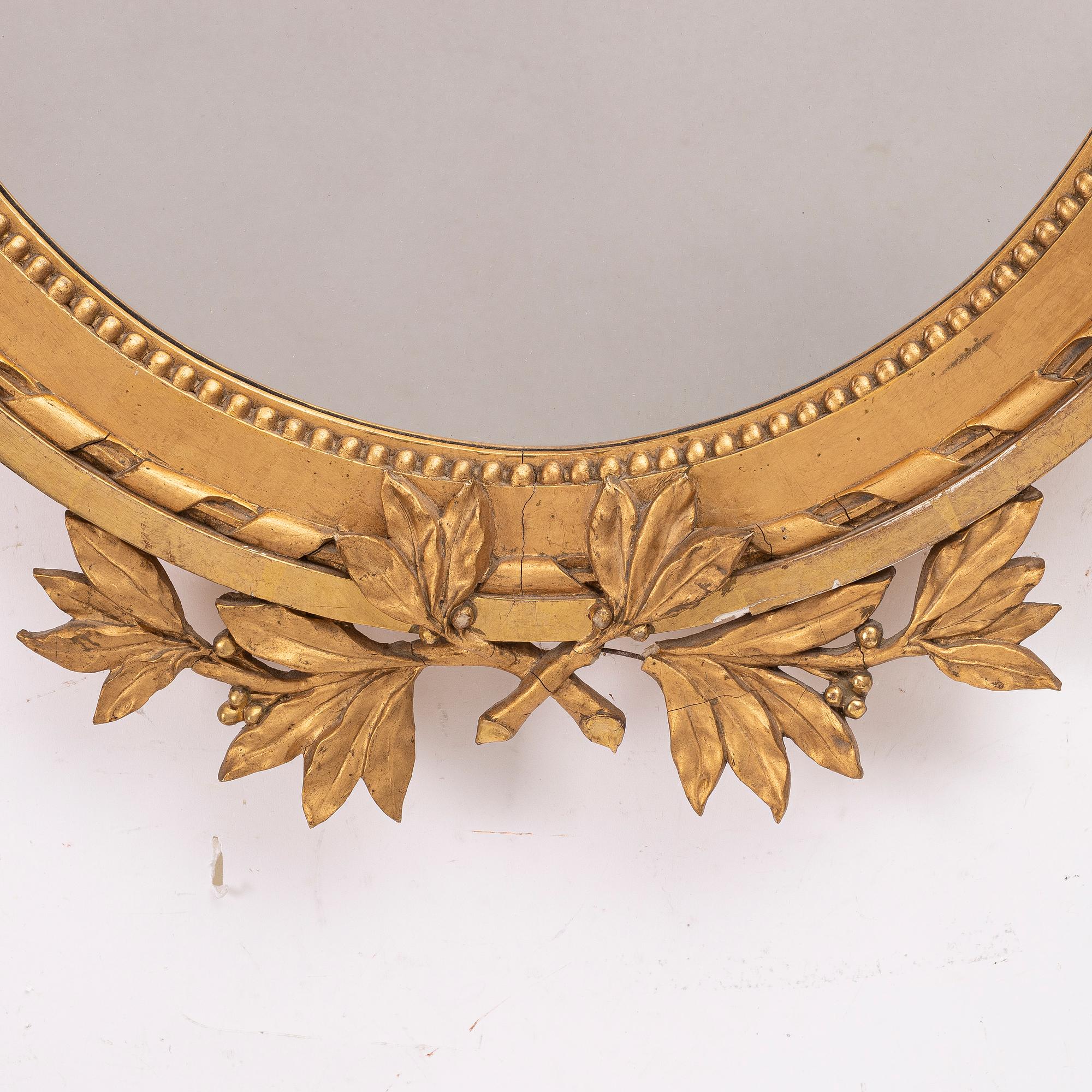 A Gustavian style mirror, early 20th century.