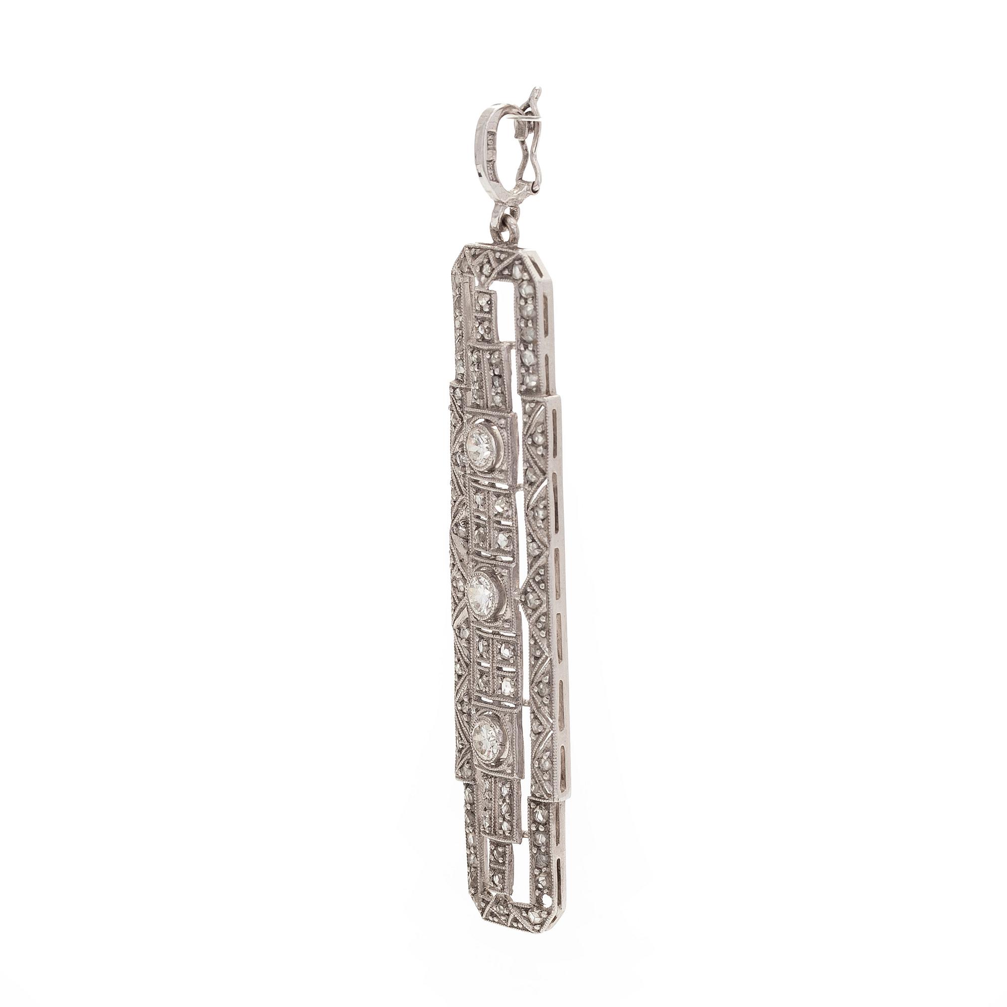 An 18K white gold pendant set with brilliant-cut and rose-cut diamonds.