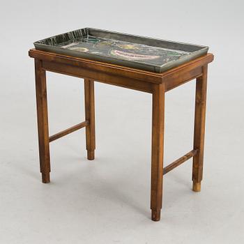 A stoneware tray table signed Bryk.