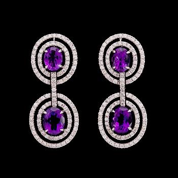 925. A pair of amethyst and brilliant cut diamond earrings, tot. 1.90 ct.