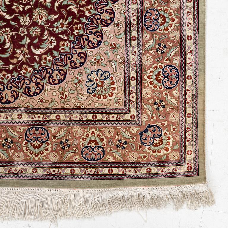 A oriental silk rug, c. 148 x 100 cm.