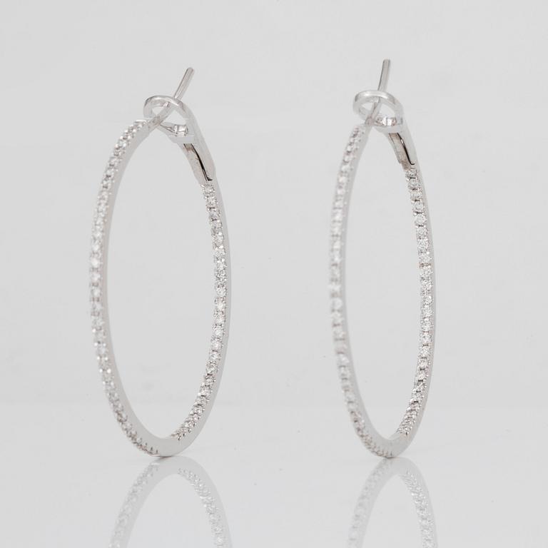 A pair of brilliant-cut diamond hoop earrings. Total carat weight circa 1.00 ct.