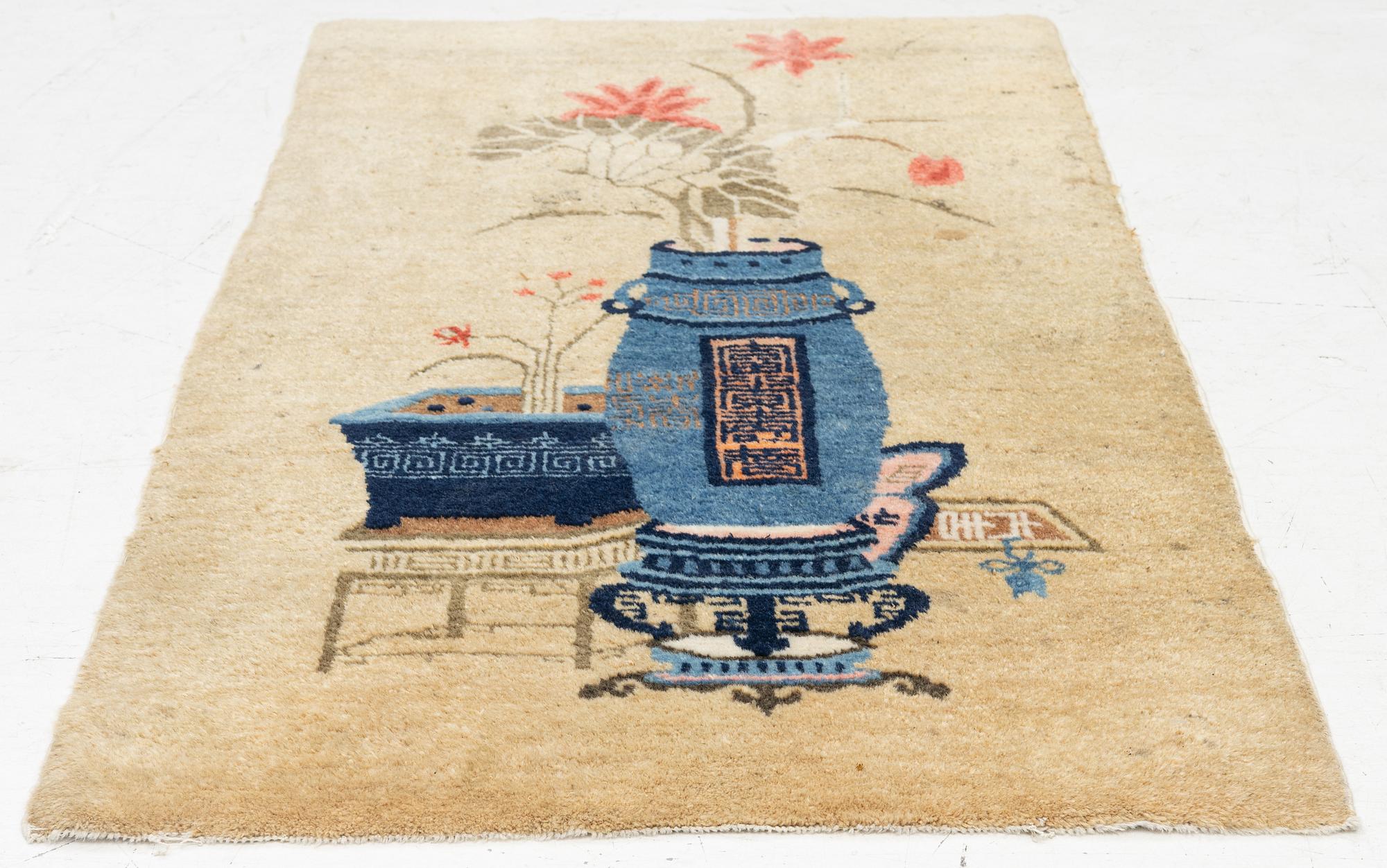 An antique Baotou rug, China, c. 127 x 66 cm.