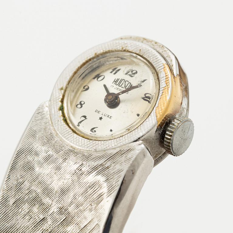 Aftonklocka/armring, Bo Dolk, 18K vitguld med briljantslipade diamanter, 1970-tal.