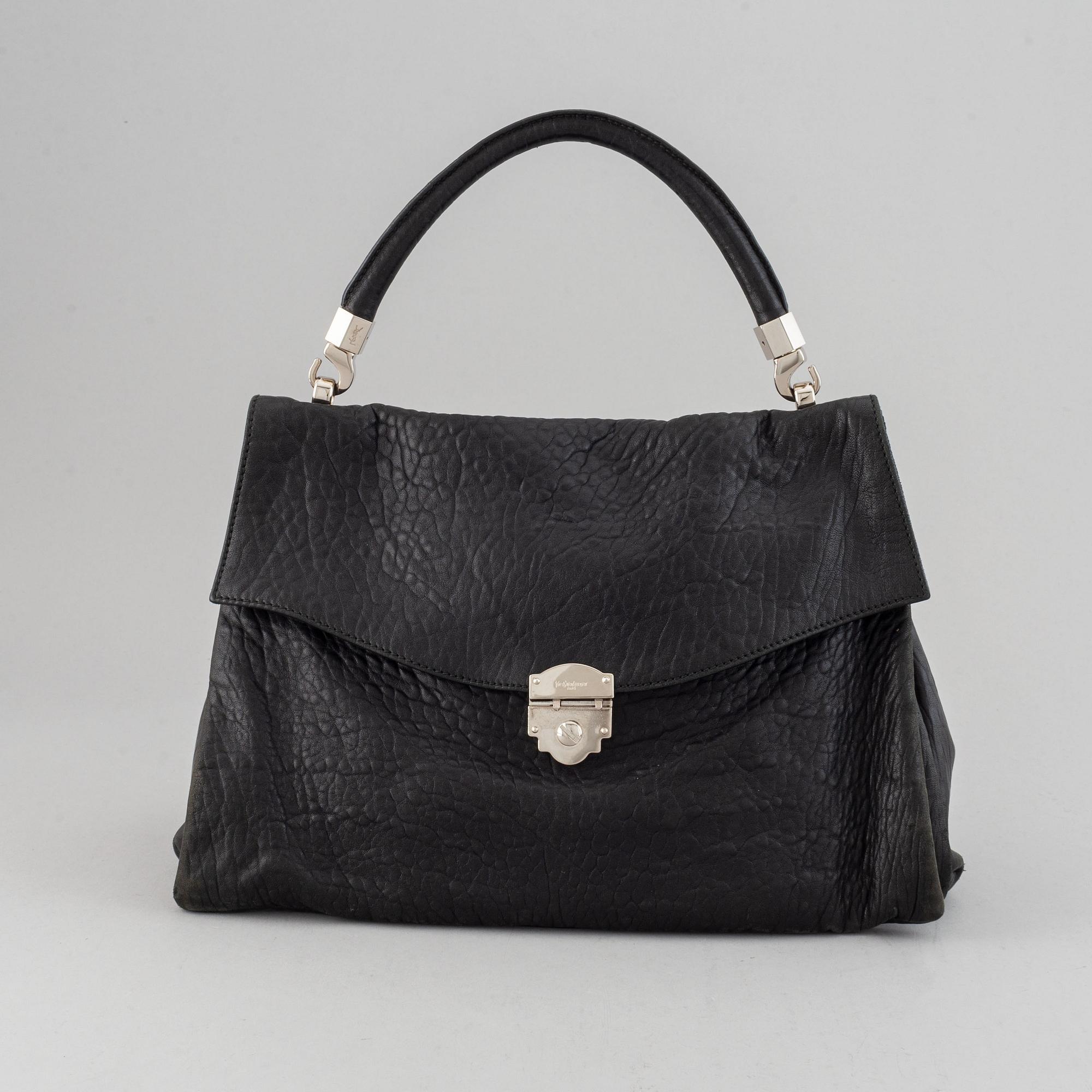 Yves Saint Laurent, a black leather bag.