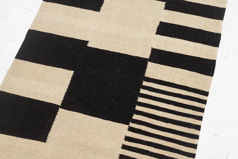 A kilim runner, c. 393 x 93 cm.