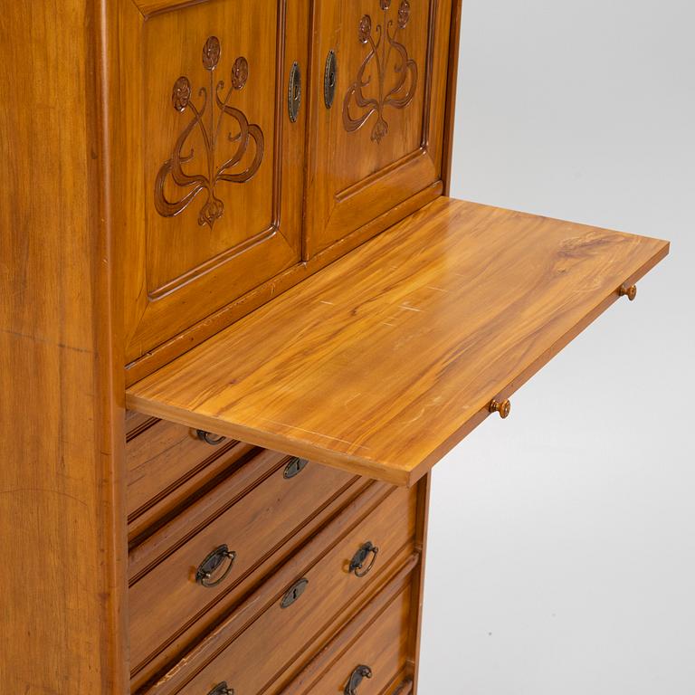 A walnut veneered tall boy dresser, early 20th century.