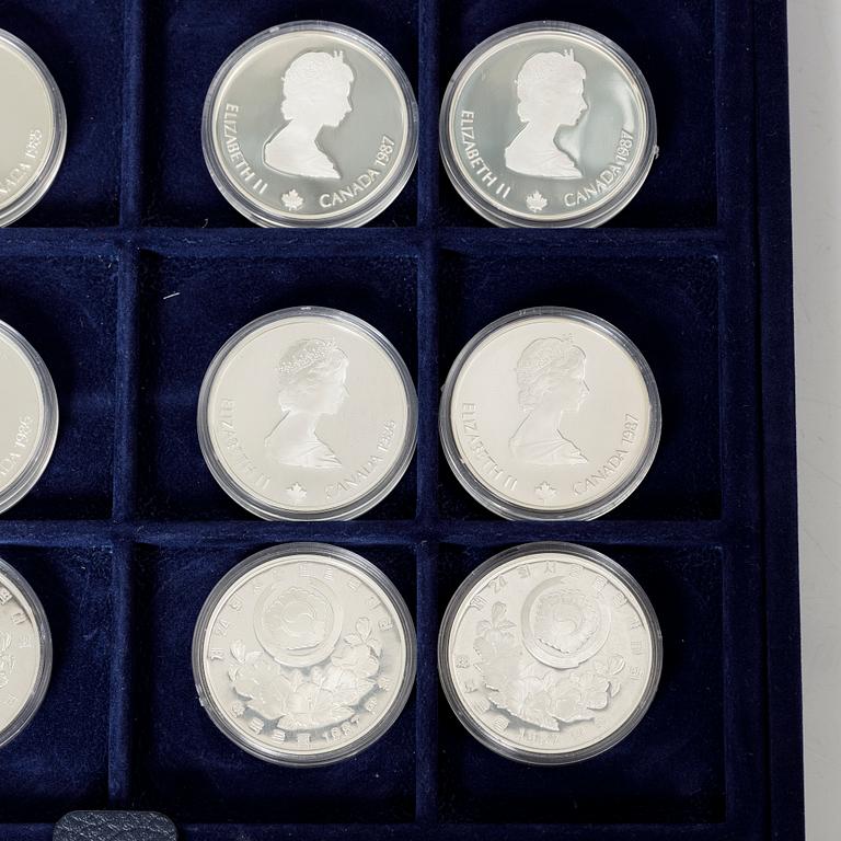 Twelve commemorative sterling silver coins, Olympic Games, Calgary and Seoul, 1988.