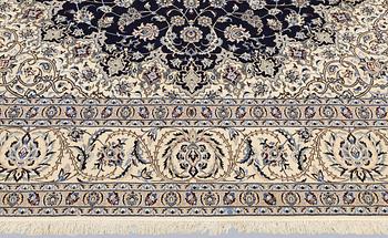 A part silk Nain carpet, so-called 4LAA, approx. 318 x 219 cm.