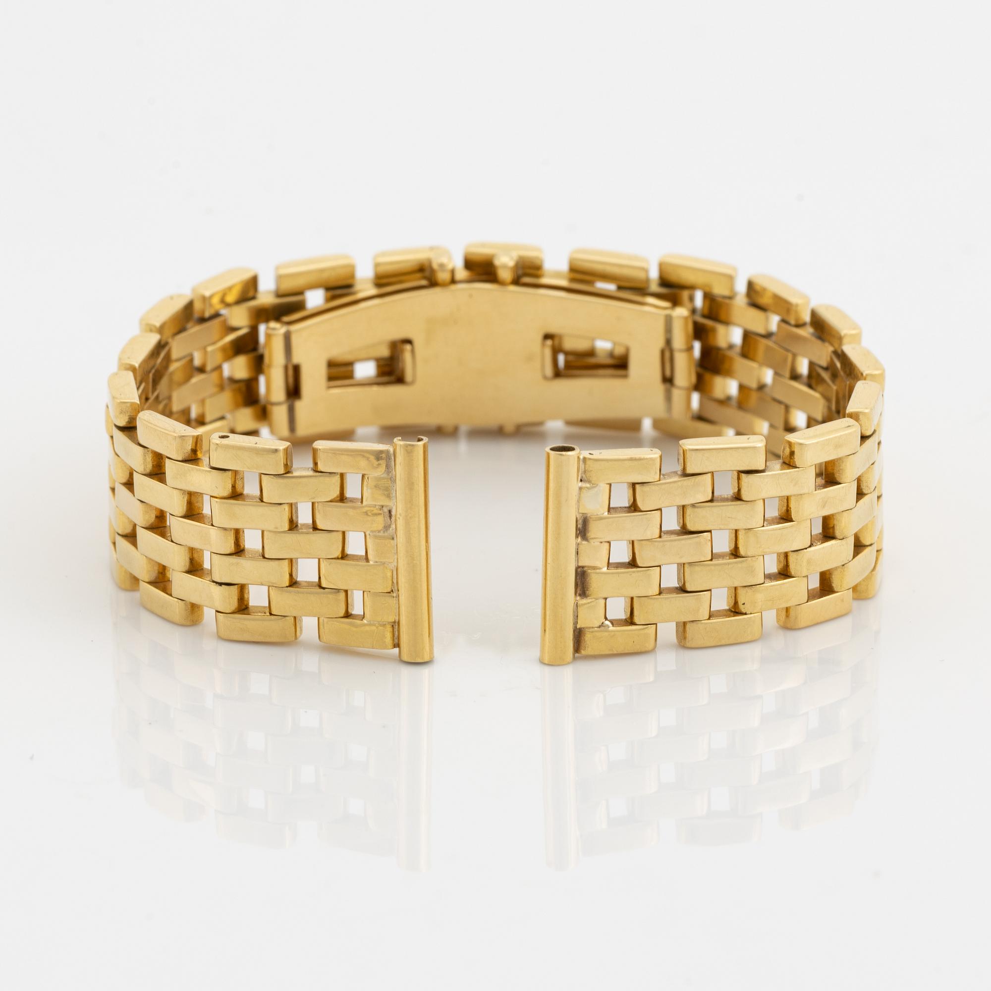 An 18K gold watch bracelet.
