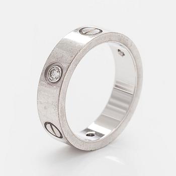 Cartier, sormus, "Love", 18K valkokultaa ja kolme briljanttihiottua timanttia.