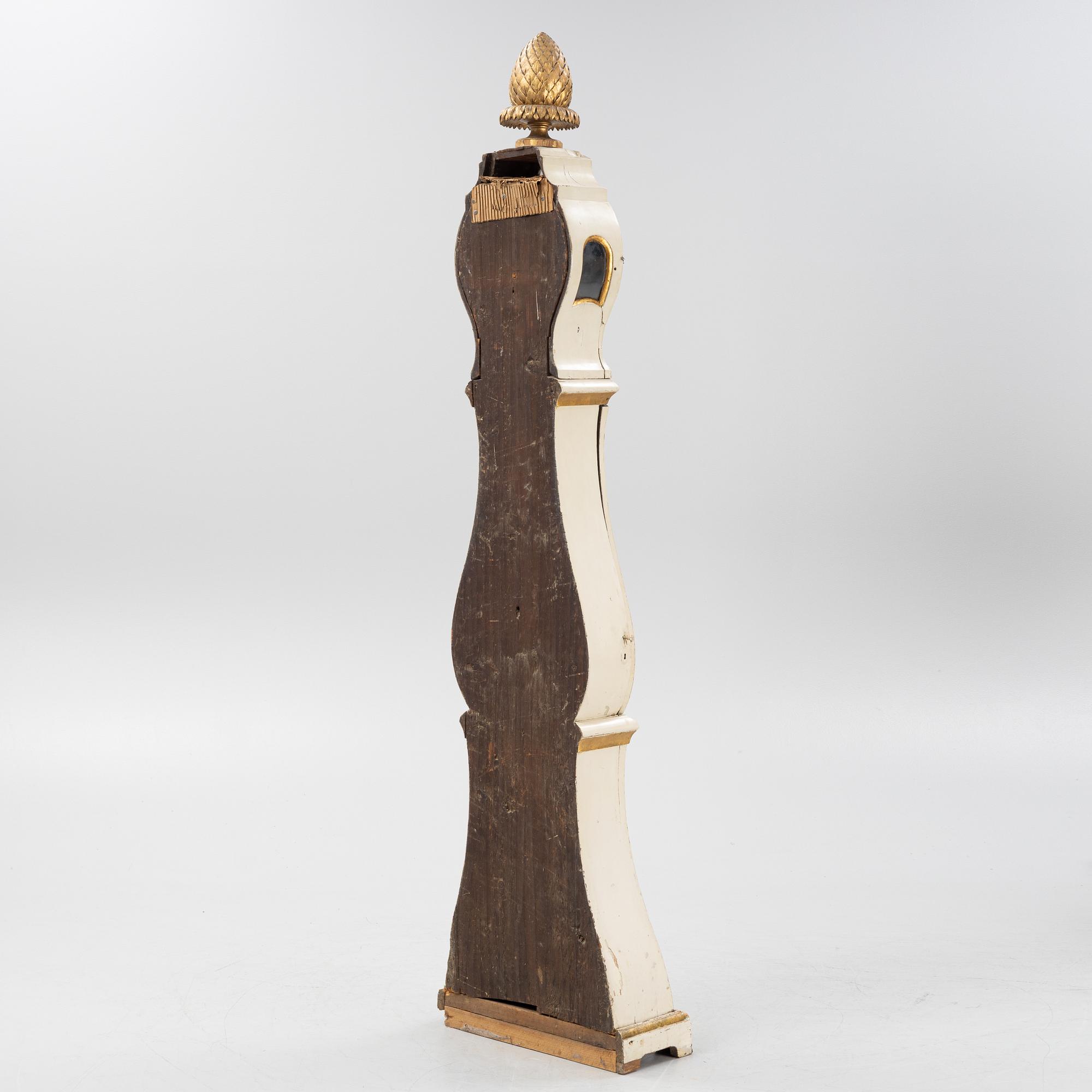 A long-case clock, 19th century.
