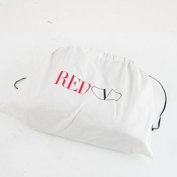 Valentino Red, A black leather snake bag.