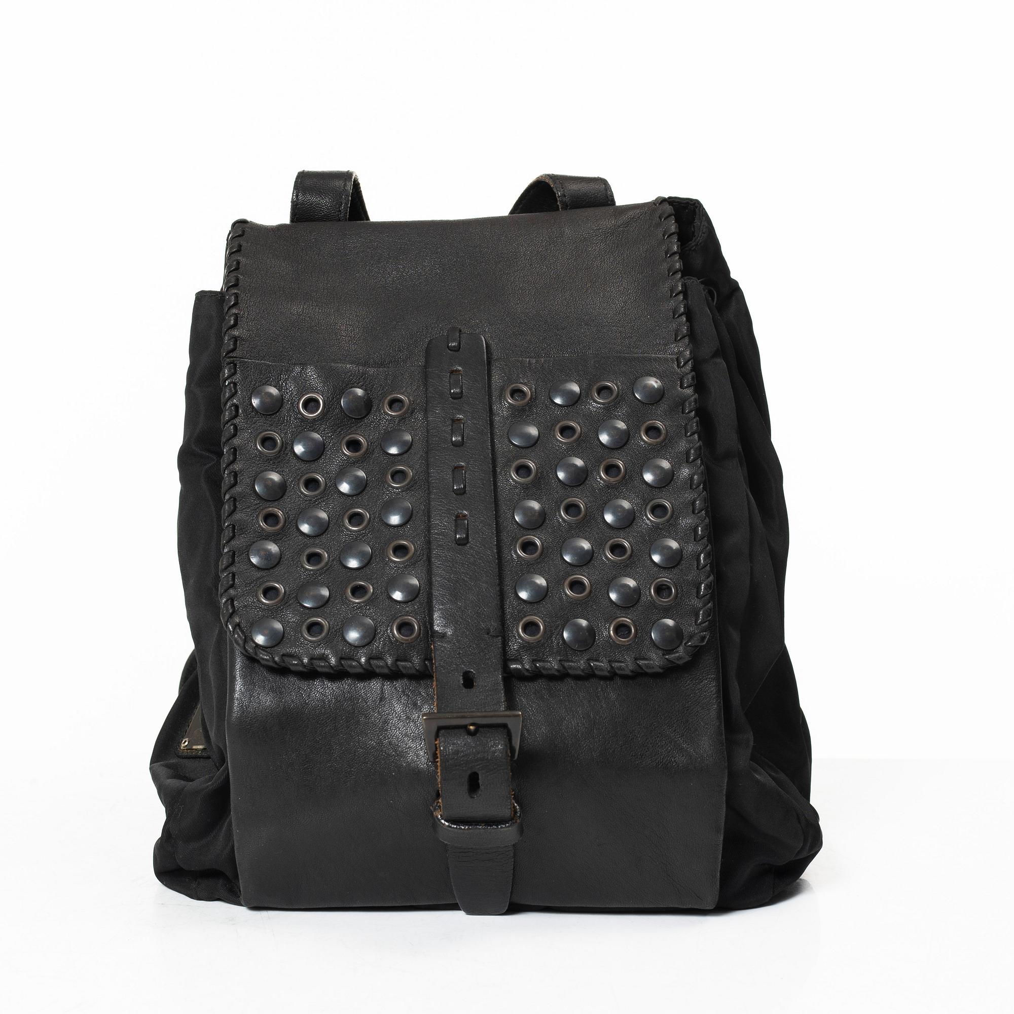 Prada, A nylon and leather backpack.