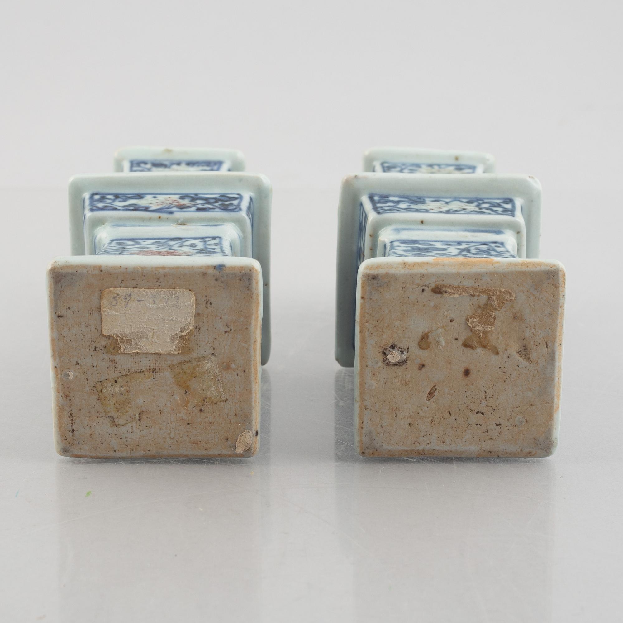 A pair of Chinese porcelain altar sticks, late Qing dynasty.