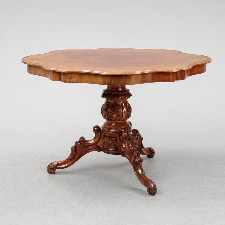 A rococo style sofa, four chairs and a table, second half of the 19th Century.
