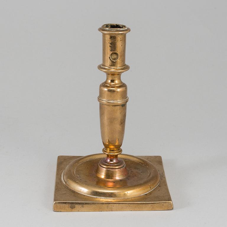 A 17th century bronze candlestick.