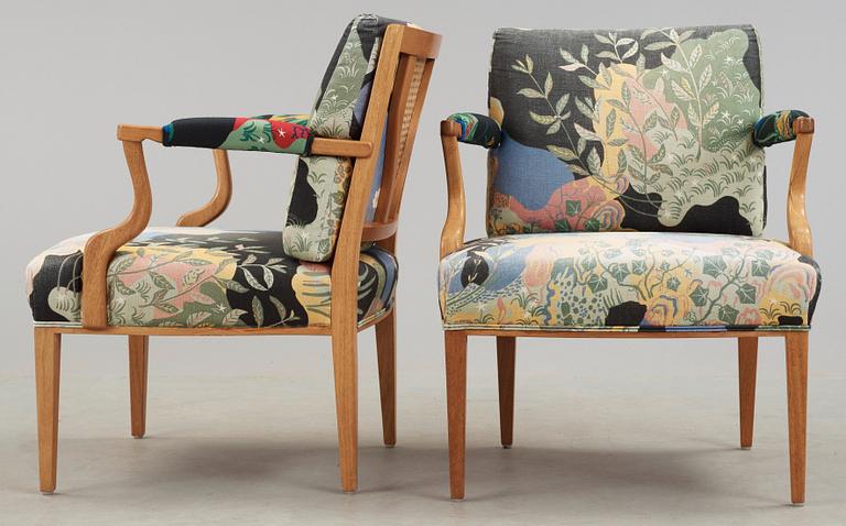 A pair of Josef Frank mahogany and ratten armchairs, Svenskt Tenn, model 969.