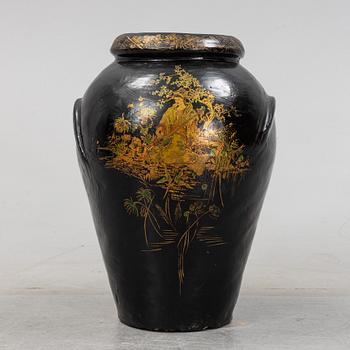 A 20th Century earhten ware urn.