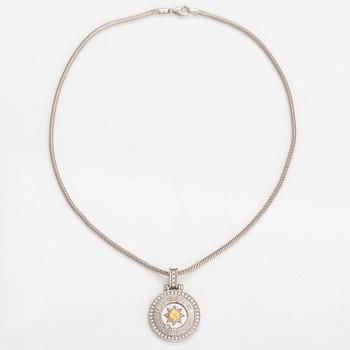 HOROSKOOPPIRIIPUS ketjulla, 14K ja 18K kultaa, timantteja n. 0.78 ct yht.