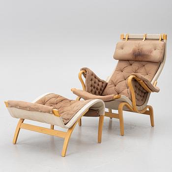 Bruno Mathsson, a 'Pernilla' armchair and ottoman, Dux.