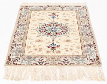 A part silk Isfahan rug, signed, c. 125 x 84 cm.