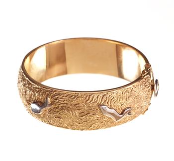 An Olle Ohlsson 18k gold bangle,