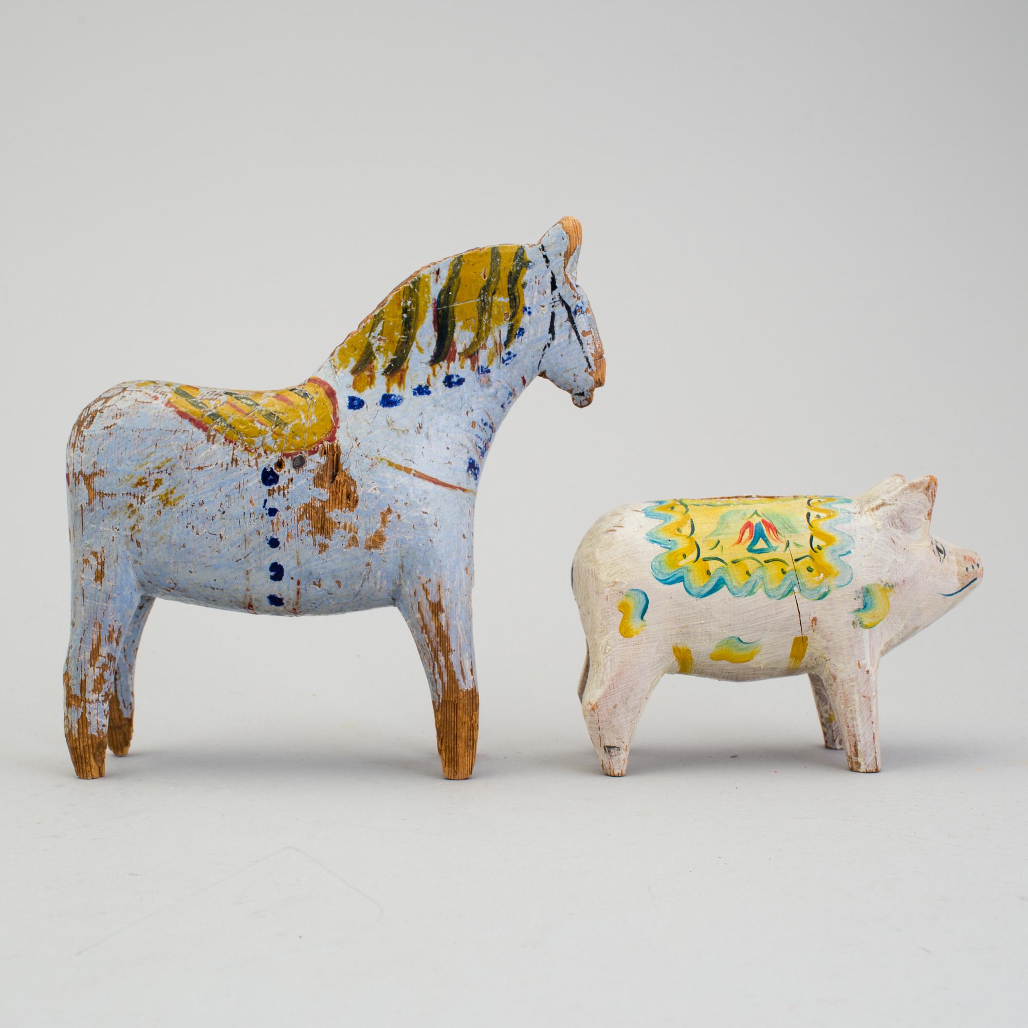 A painted folk art dala horse and dala pig, first half of the 20th century.