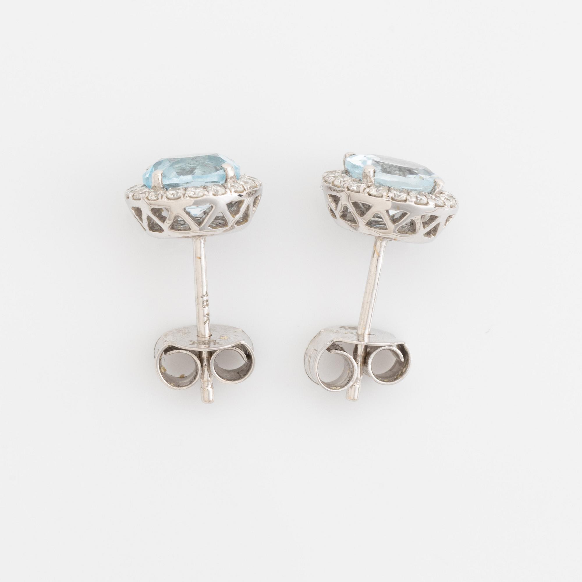 Blue topaz and brilliant cut diamond earrings and necklace.