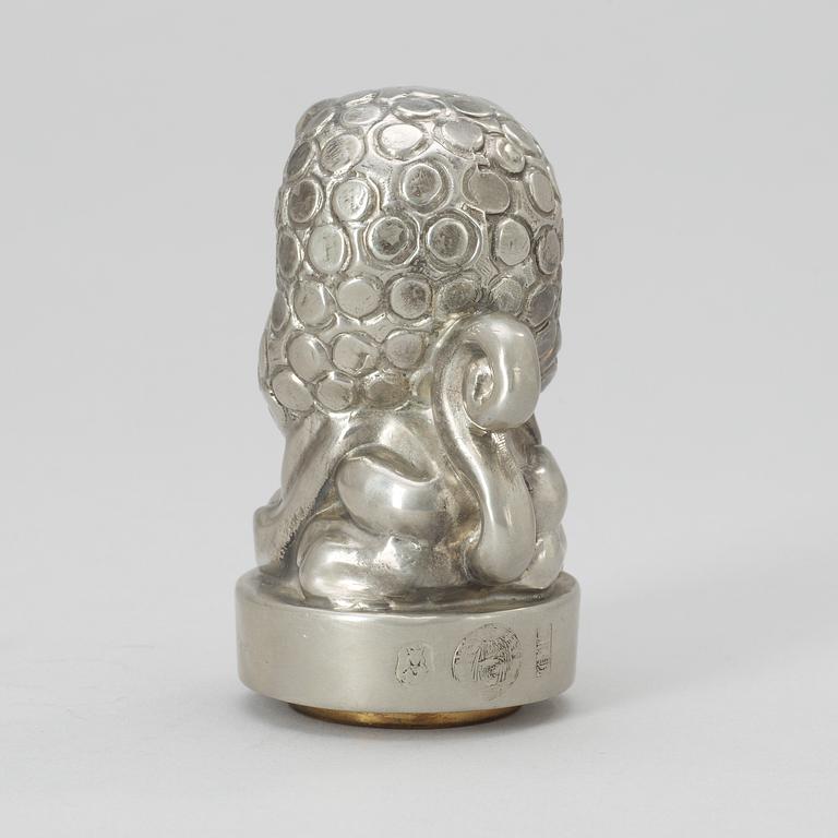 An Anna Petrus pewter and brass seal by Svenskt Tenn 1981.