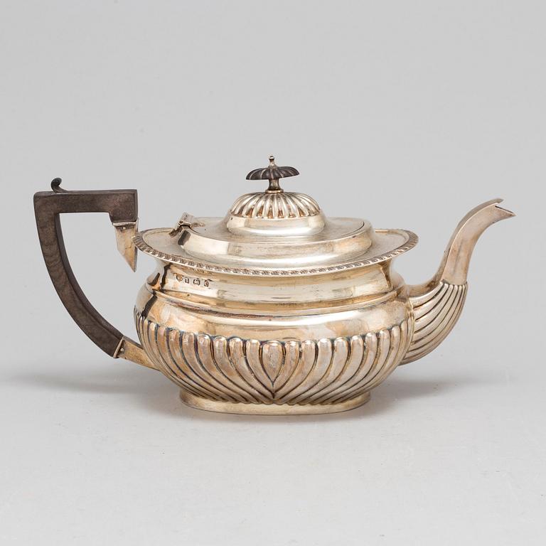 A silver teapot by William Aitken,  Birmingham 1902.