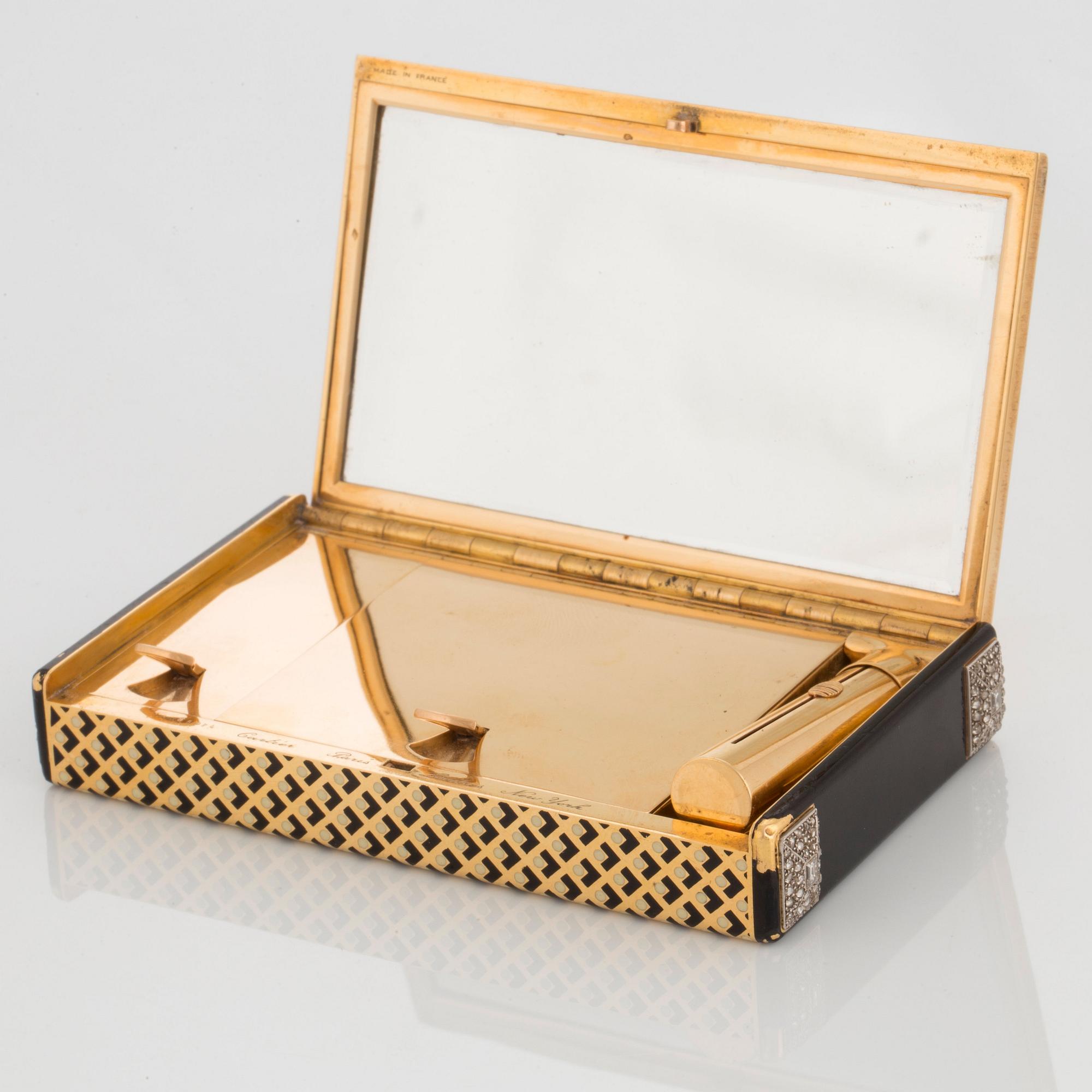 Cartier Art Deco Vanity Case 18K guld med svart emalj och baguette- och rosenslipade diamanter.