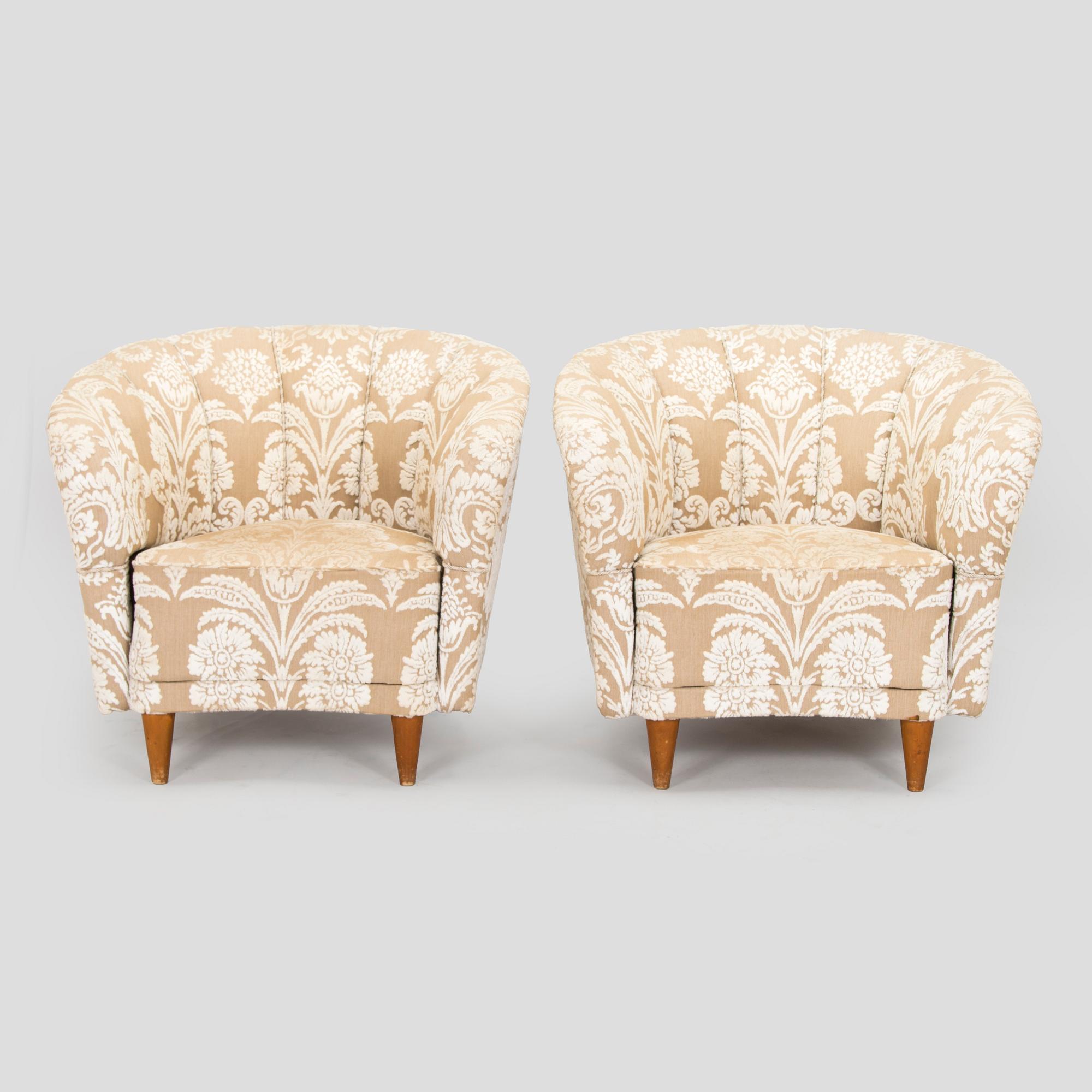 A pair of mid-20th century armchairs.