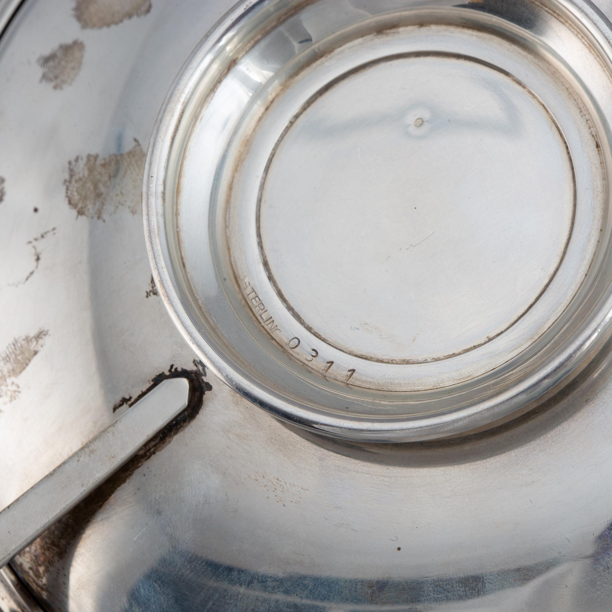 A pair of sterling silver tazzaz.