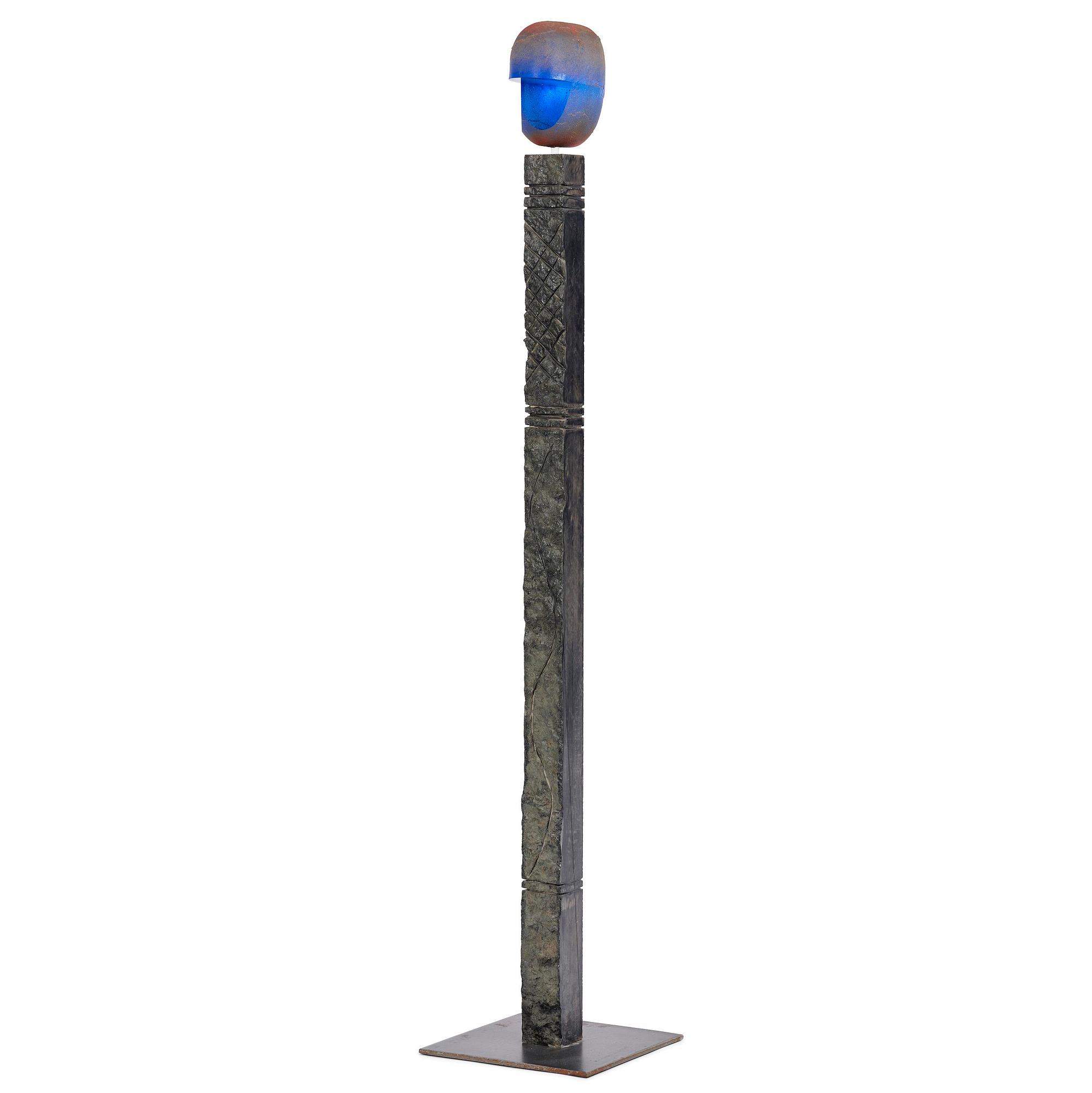 Bertil Vallien, a unique sand-cast glass sculpture of a head, on a high pedestal of polished limestone, Kosta Boda.