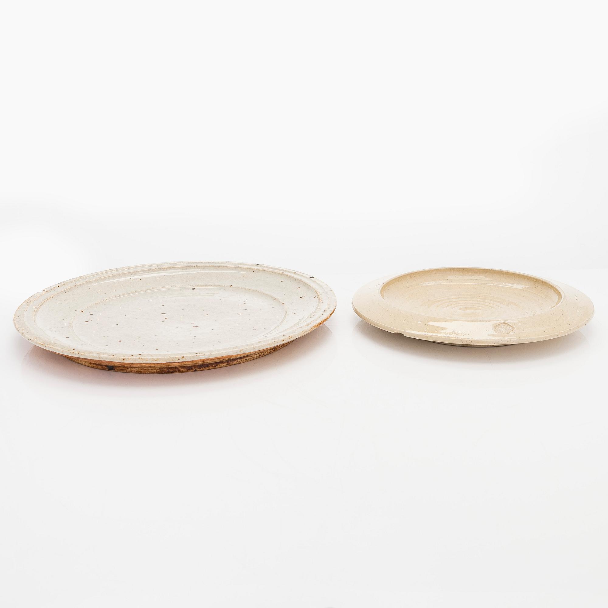 Kyllikki Salmenhaara, two stoneware plates signed KS and a book signed by Kyllikki Salmenhaara.