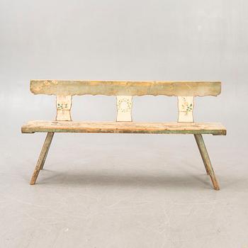 A painted early 1900s bench.
