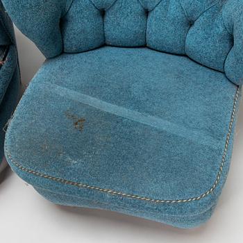 A pair of mid-20th-century armchairs.
